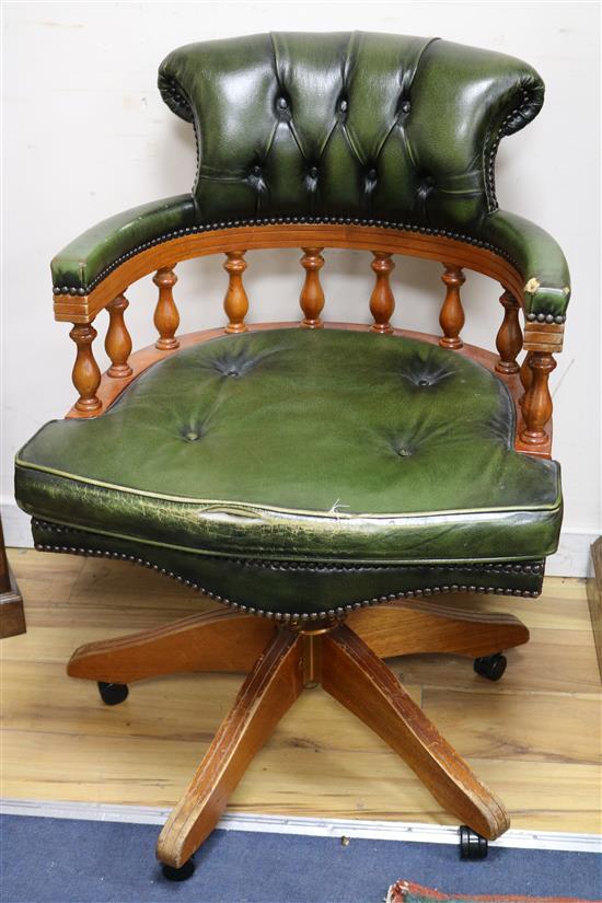 A pair of leather swivel desk chairs